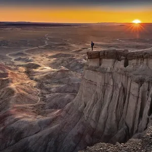 Tourist standing on rock formation Tsagaan Suvarga Tourist standing on rock formation Tsagaan Suvarga