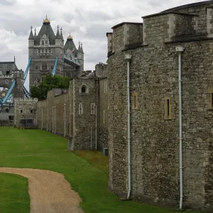 Tower view beyond historic stone walls and pathway at The Tower of London