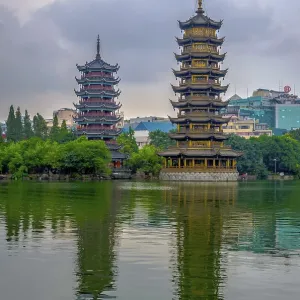 Two towers, pagodas of Sun and Moon by the lake Two towers, pagodas of Sun and Moon by the lake