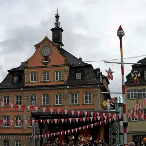 Town square with historic architecture and decorations indicative of a festival or event