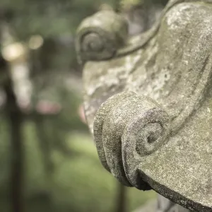 Traditional asian stone lantern in garden