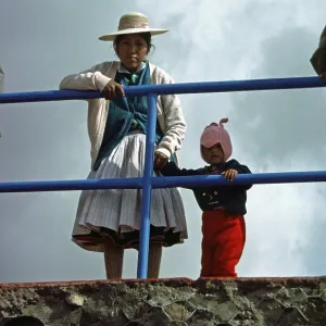 Traditionally dressed young woman with infant