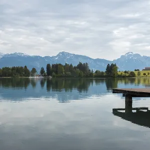 A tranquil lake with a wooden jetty