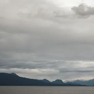 A tranquil seascape with mountains A tranquil seascape with mountains