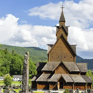 Travel to Norway in summer. The Stave Church is crowned with crosses Travel to Norway in summer. The Stave Church is crowned with crosses