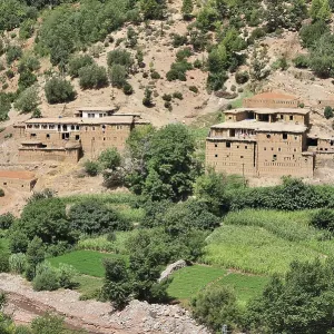 Typical Berber village with traditional adobe houses and small kasbahs in the mountains of the High Atlas Typical Berber village with traditional adobe houses and small kasbahs in the mountains of the High Atlas