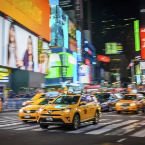 Typical yellow taxis in traffic Typical yellow taxis in traffic