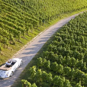 UAV recording, businessman in a vintage car UAV recording, businessman in a vintage car