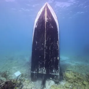 Upright wreck of sport fishing boat Upright wreck of sport fishing boat