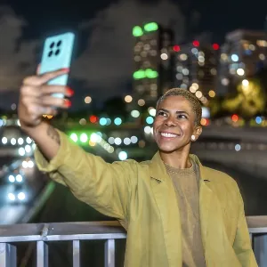 Urban Night Selfie Print: Woman with Smartphone