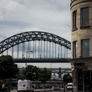 An urban scene with an arch bridge over a road An urban scene with an arch bridge over a road