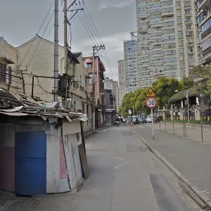 Urban street with old and modern buildings along a sidewalk