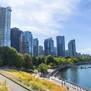 Vancouver's modern cityscape rises above a vibrant waterfront park