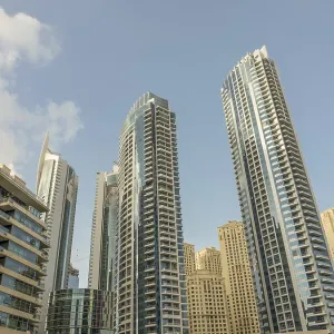 Various modern skyscrapers with glass facades rise into the sky
