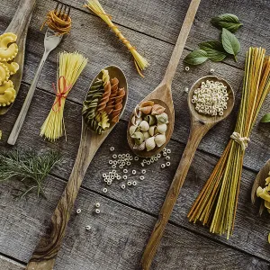 Various pasta on wooden spoons Various pasta on wooden spoons