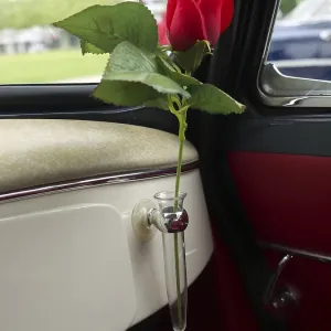 Vase with rose in an old Lloyd car