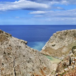 Vertical view of z-shaped lagoon in typical Greek or Cretan landscape on sunny summer day Vertical view of z-shaped lagoon in typical Greek or Cretan landscape on sunny summer day