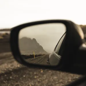 Vestrahorn mountain in the side mirror of Auto