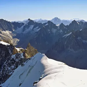 View from the Aiguille du Midi mountain station observation deck of the mountains Les Droites