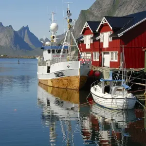 View of boats in the harbour, red wooden rorbu houses View of boats in the harbour, red wooden rorbu houses