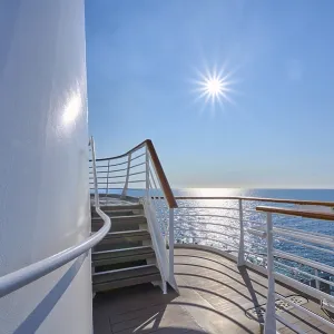 View from the deck of a cruise ship Mein Schiff 6 to the sunny sea and clear sky