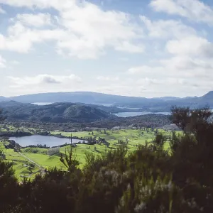 View of hilly landscape with lake View of hilly landscape with lake
