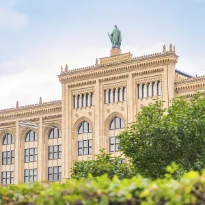 View of a historic building with a statue on the roof