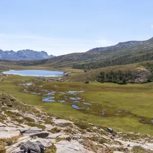 View over Lac de Nino with the mountain landscape of Restonica in the background View over Lac de Nino with the mountain landscape of Restonica in the background