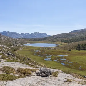 View over Lac de Nino with the mountain landscape of Restonica in the background View over Lac de Nino with the mountain landscape of Restonica in the background