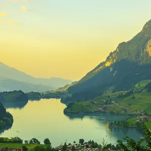 View over Lake Lungern and Village with Mountain in Sunset in Lungern