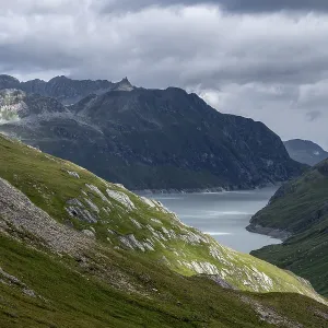 View of a lake in a valley surrounded by mountains