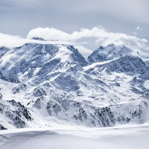 View of mountain panorama with mountain peaks of the Bernina Group
