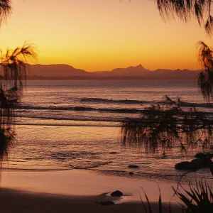 View of the ocean and Wategos Beach on the promenade at sunset View of the ocean and Wategos Beach on the promenade at sunset