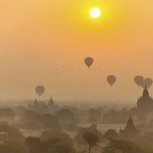 View of pagodas with hot air balloons