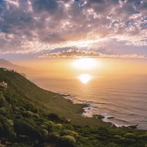 View of the Pico del Teide with setting sun in the sea View of the Pico del Teide with setting sun in the sea