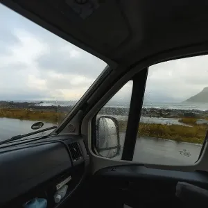 View from a rainy campervan window on Flakstad beach View from a rainy campervan window on Flakstad beach