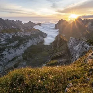 View over Saentis mountains into the valley of Meglisalp at sunrise View over Saentis mountains into the valley of Meglisalp at sunrise