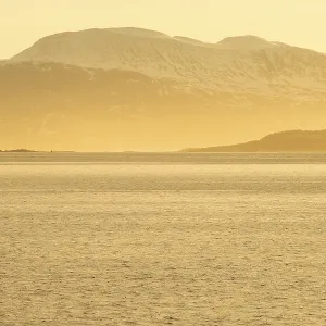 View across the sound to the mountains of the mainland in the morning light View across the sound to the mountains of the mainland in the morning light