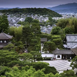 View of the Zen garden of Ginkaku-ji Temple with surrounding forest landscape and mountains in the background View of the Zen garden of Ginkaku-ji Temple with surrounding forest landscape and mountains in the background