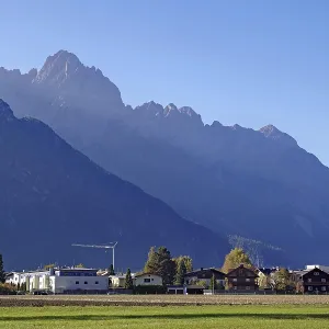 Village at the foot of rugged mountains