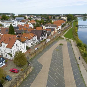 A village with half-timbered houses on the riverbank