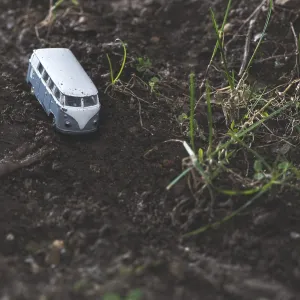 Vintage bus VW. Small metal toy in the nature