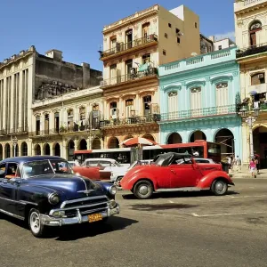Vintage car in front of buildings with colourful facades Vintage car in front of buildings with colourful facades