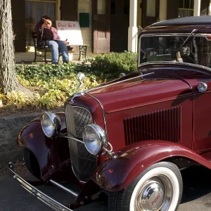 Vintage car parked in front of a typical American home Vintage car parked in front of a typical American home