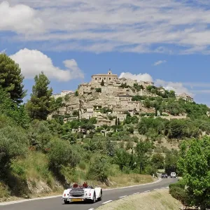 Vintage car on the road towards Gordes Vintage car on the road towards Gordes