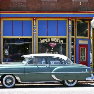 Vintage car in front of the Superman Museum in the historic district of Metropolis