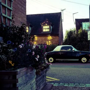 Vintage Nissan Figaro car, parked on the street Vintage Nissan Figaro car, parked on the street