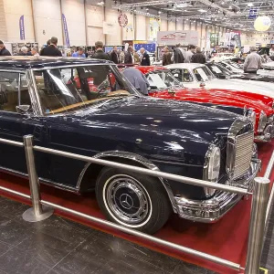 Visitors to Techno Classica take a look at a Mercedes Benz 600