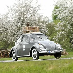 VW Beetle with skis and luggage on the roof VW Beetle with skis and luggage on the roof