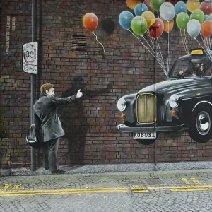 Wall graffiti, man hailing a taxi hanging on flying balloons